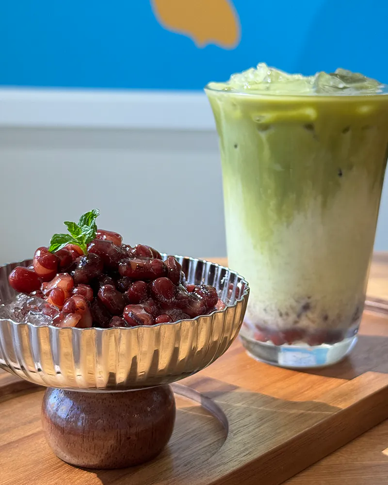 Layered orange black tea with a fresh orange slice at Hoho Smile, a Bubble Tea Store in Glendale
